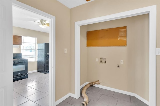 laundry area featuring hookup for an electric dryer, washer hookup, light tile patterned floors, and ceiling fan