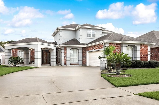 view of property featuring a front yard and a garage