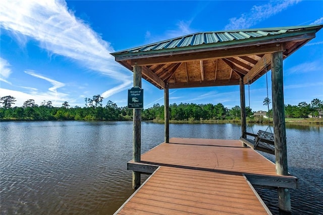 dock area with a gazebo and a water view