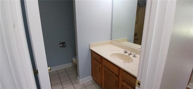 bathroom with tile patterned floors, vanity, and toilet