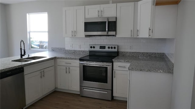 kitchen featuring white cabinetry, sink, and appliances with stainless steel finishes