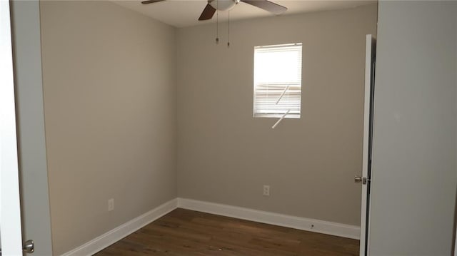 empty room featuring ceiling fan and dark hardwood / wood-style floors