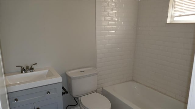 full bathroom featuring vanity, toilet, and tiled shower / bath combo