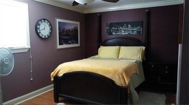 bedroom featuring ceiling fan and ornamental molding