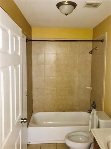 full bathroom with tile patterned flooring, vanity, toilet, and tiled shower / bath