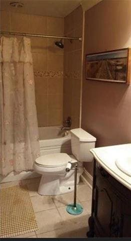 full bathroom featuring tile patterned flooring, vanity, shower / bath combination with curtain, and toilet