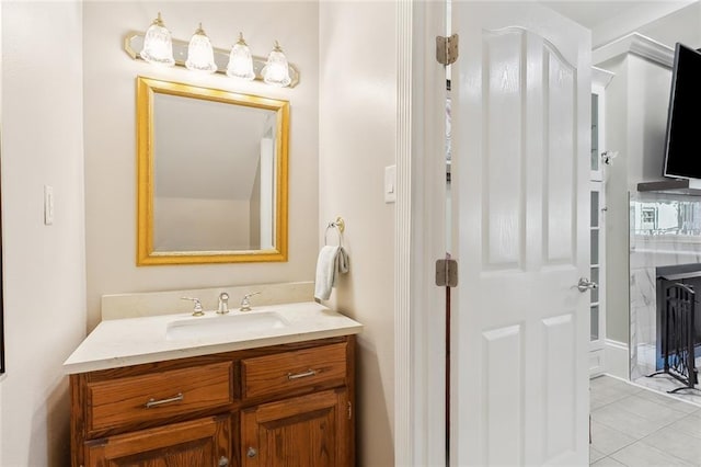 bathroom with tile patterned floors and vanity