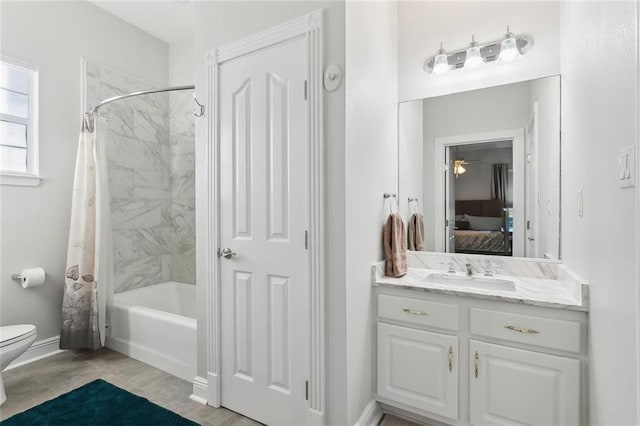 full bathroom with shower / bath combo, vanity, toilet, and ceiling fan