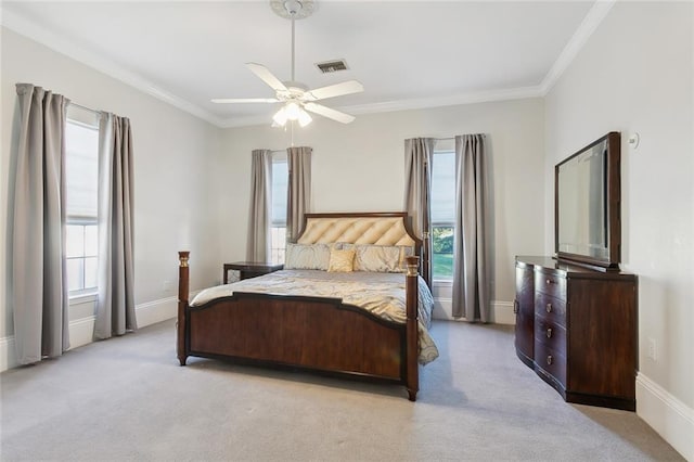 bedroom featuring light colored carpet, ceiling fan, and crown molding