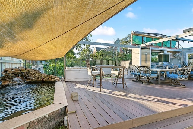 wooden terrace with a water view