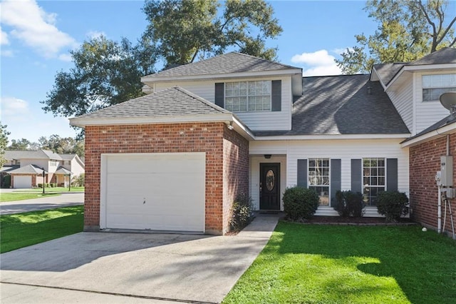 view of front property with a front lawn and a garage