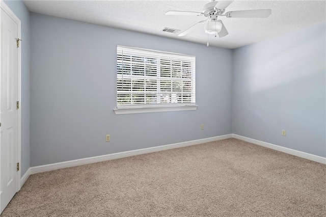 unfurnished room featuring carpet and ceiling fan