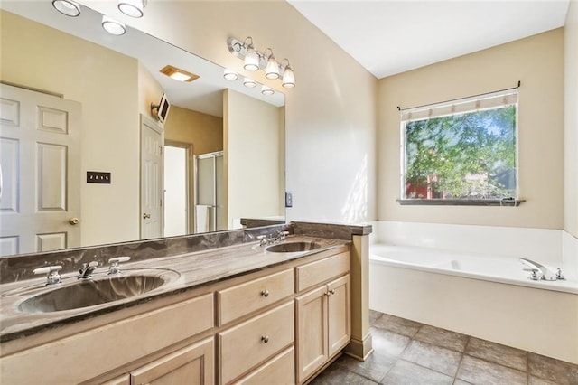 bathroom featuring plus walk in shower and vanity