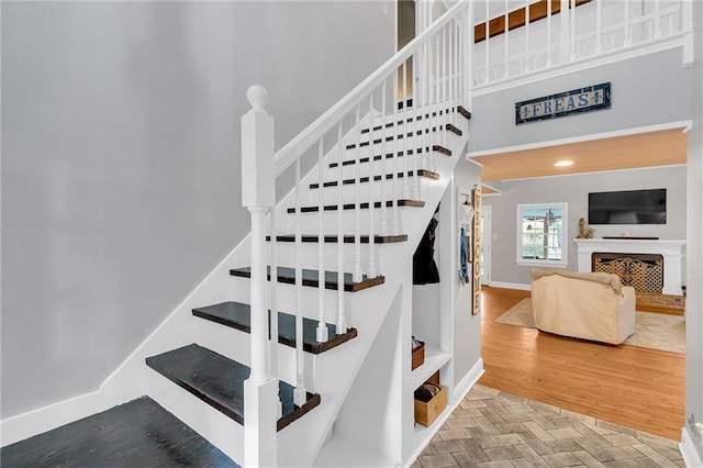 stairs featuring hardwood / wood-style flooring