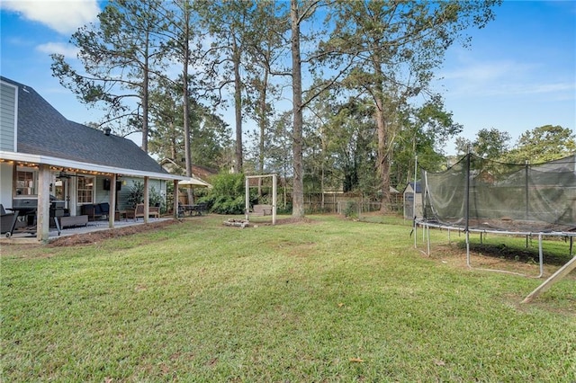 view of yard featuring a patio area and a trampoline