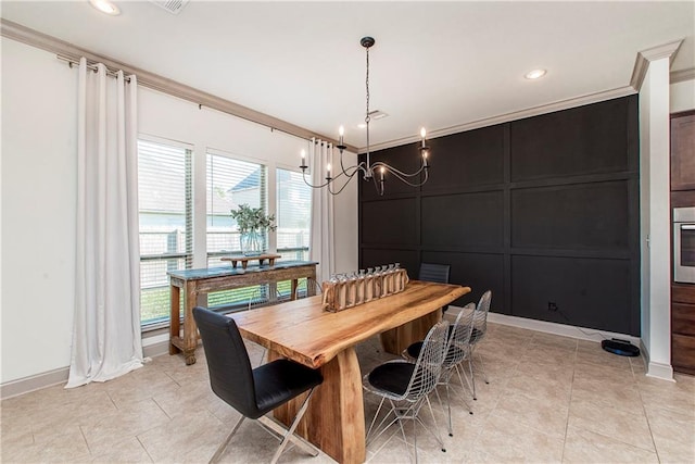 tiled dining space with a notable chandelier and ornamental molding