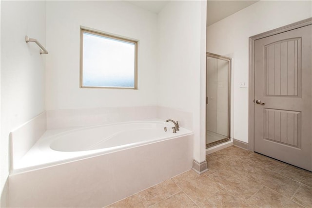 bathroom with separate shower and tub