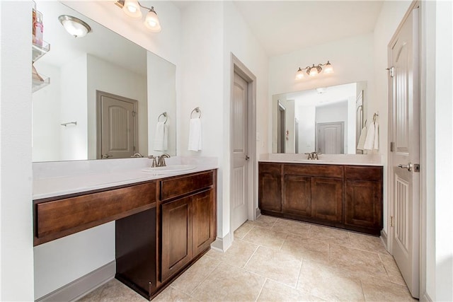 bathroom with tile patterned flooring and vanity