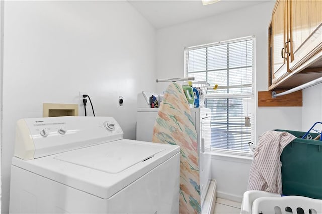 washroom featuring cabinet space and washer hookup