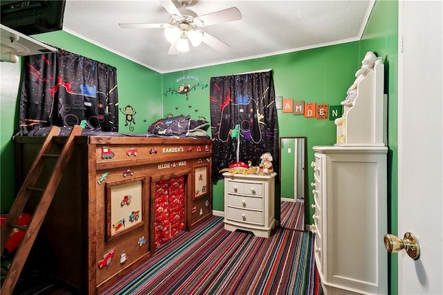 bedroom with ceiling fan and ornamental molding