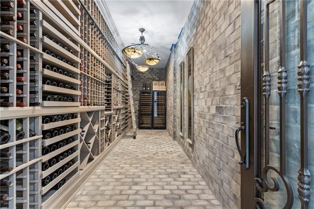 wine cellar featuring brick wall