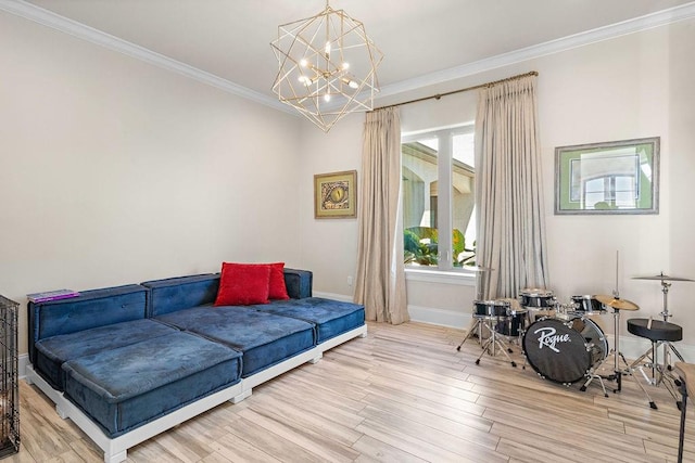 living area with ornamental molding, wood-type flooring, and a notable chandelier