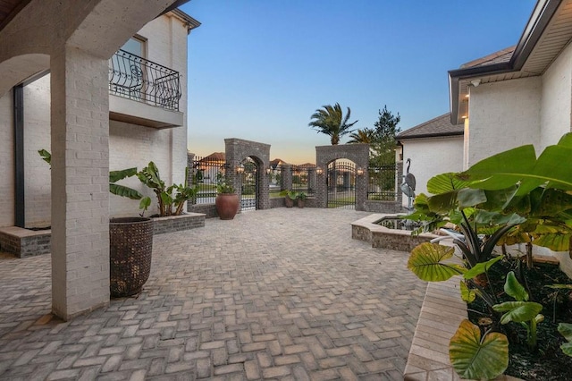 view of patio terrace at dusk