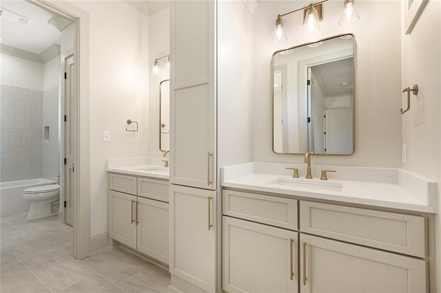 bathroom featuring visible vents, shower / bath combination, vanity, and toilet