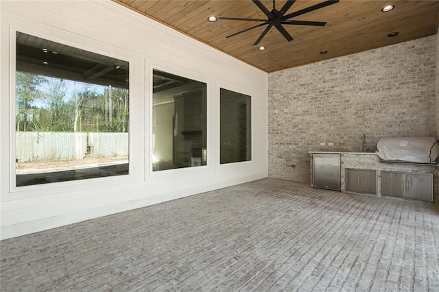 view of patio featuring a ceiling fan, fence, grilling area, and area for grilling