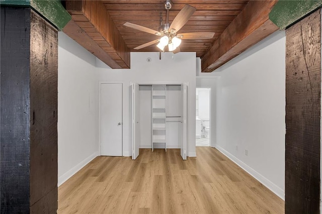 unfurnished bedroom with beamed ceiling, light wood-type flooring, ceiling fan, and wood ceiling