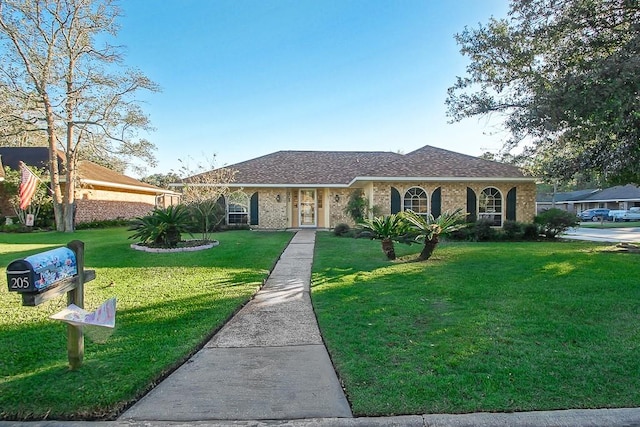 single story home with a front yard