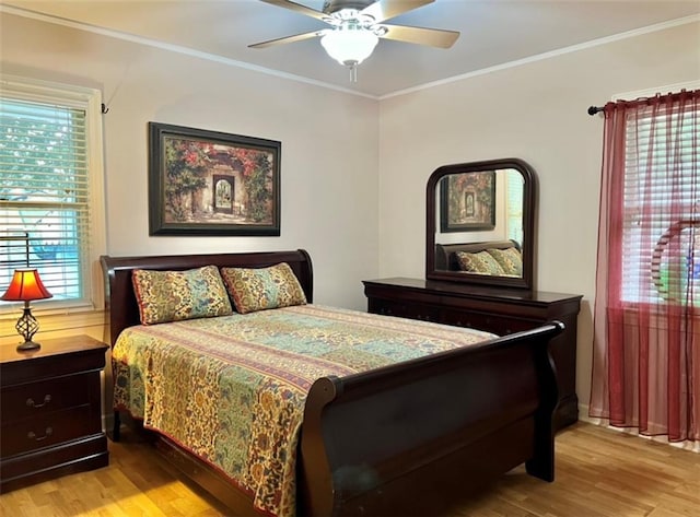 bedroom with ceiling fan, ornamental molding, and light hardwood / wood-style floors