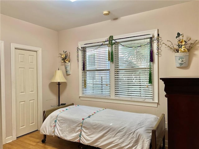 bedroom with light hardwood / wood-style flooring