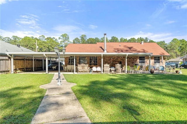 back of house with outdoor lounge area and a lawn