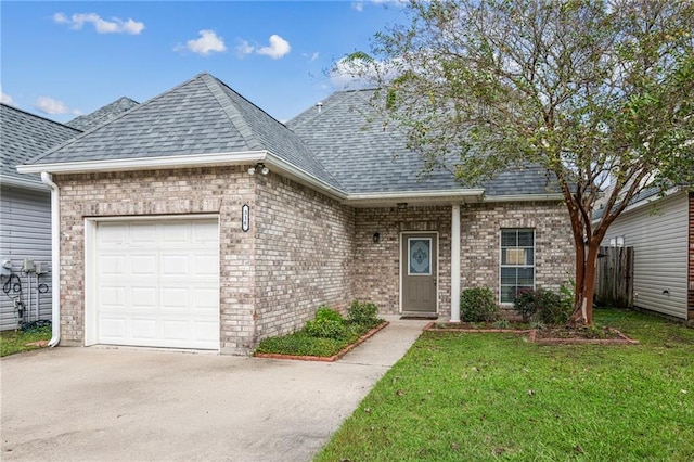 view of front of home featuring a garage and a front yard