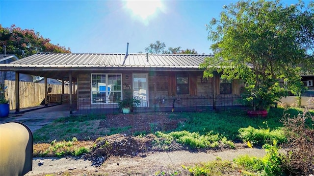 view of front of home with a carport