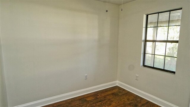 361 Helis Dr, Westwego, LA 70094 - empty room with baseboards and dark wood-style floors