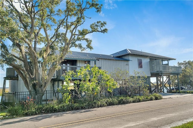view of building exterior with a fenced front yard