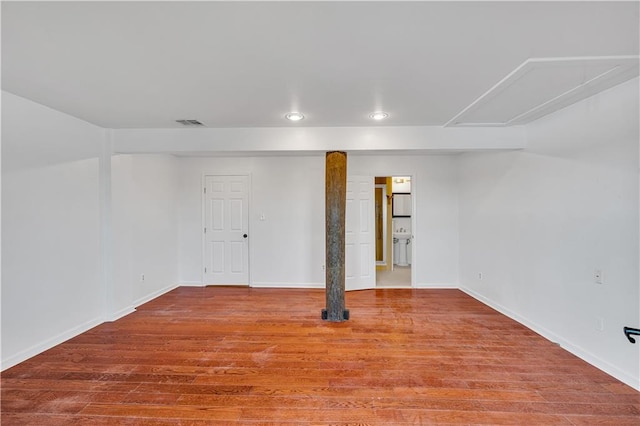 spare room featuring wood-type flooring