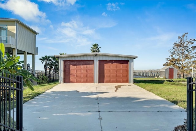 garage featuring a yard