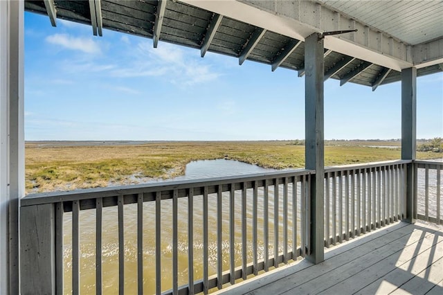 wooden deck featuring a water view