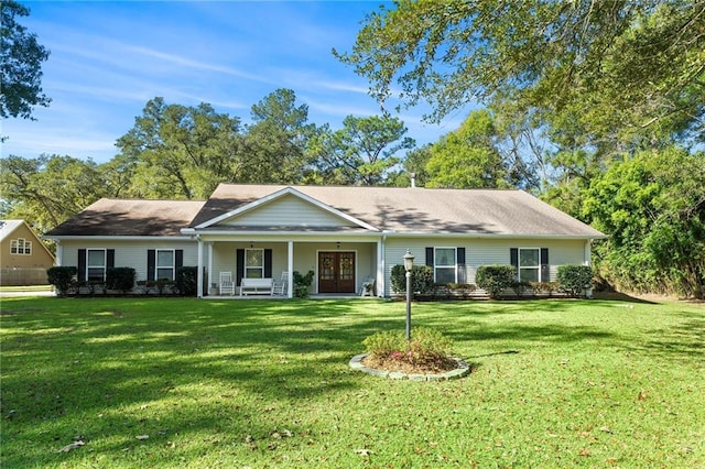 ranch-style house with a front lawn, a porch, and french doors