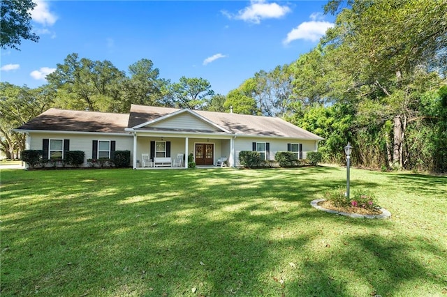 single story home with a porch and a front yard