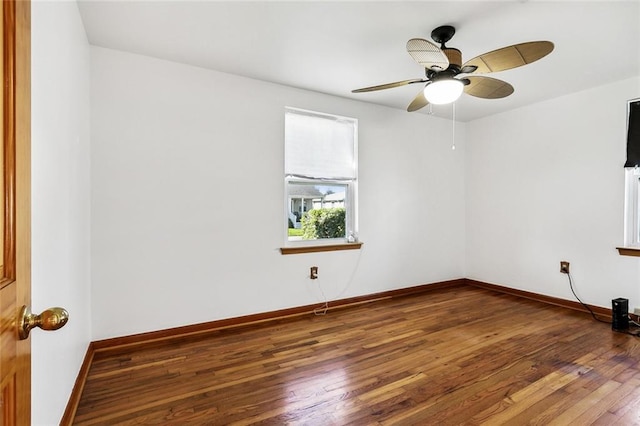 spare room featuring hardwood / wood-style floors and ceiling fan