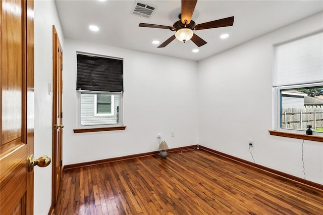 unfurnished room with ceiling fan and hardwood / wood-style flooring