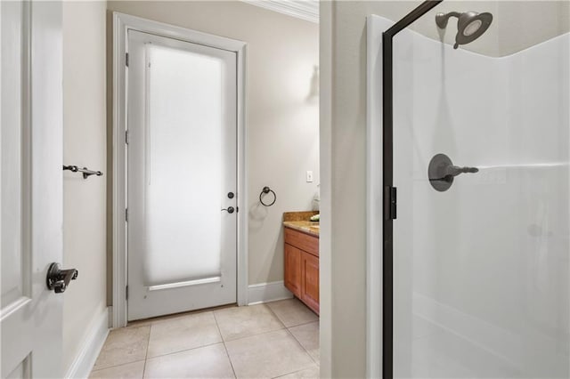 bathroom with tile patterned flooring, vanity, and an enclosed shower