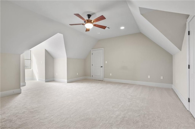 bonus room featuring ceiling fan, light carpet, and lofted ceiling