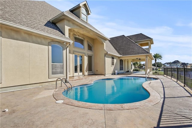 view of pool featuring french doors, a patio, and ceiling fan