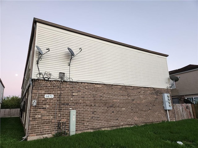 view of property exterior at dusk