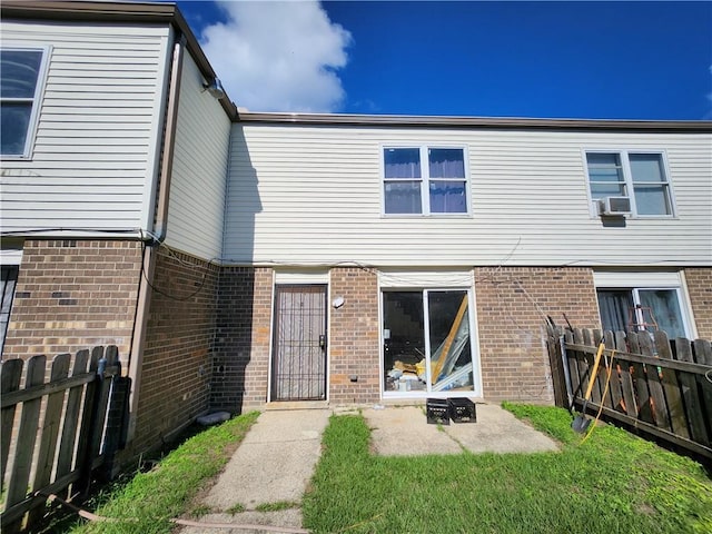 rear view of property with cooling unit